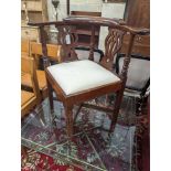 A George III mahogany corner elbow chair, width 76cm, depth 64cm, height 81cm