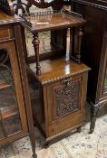 A Victorian carved walnut mirrored back coal purdonium, width 36cm, depth 35cm, height 96cm