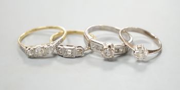 Four assorted diamond dress rings including two 18ct and two white metal, gross 10 grams,