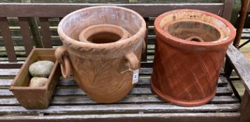 Six terracotta garden planters and three pebble ornaments, largest diameter 40cm, height 40cm