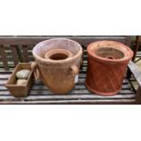 Six terracotta garden planters and three pebble ornaments, largest diameter 40cm, height 40cm