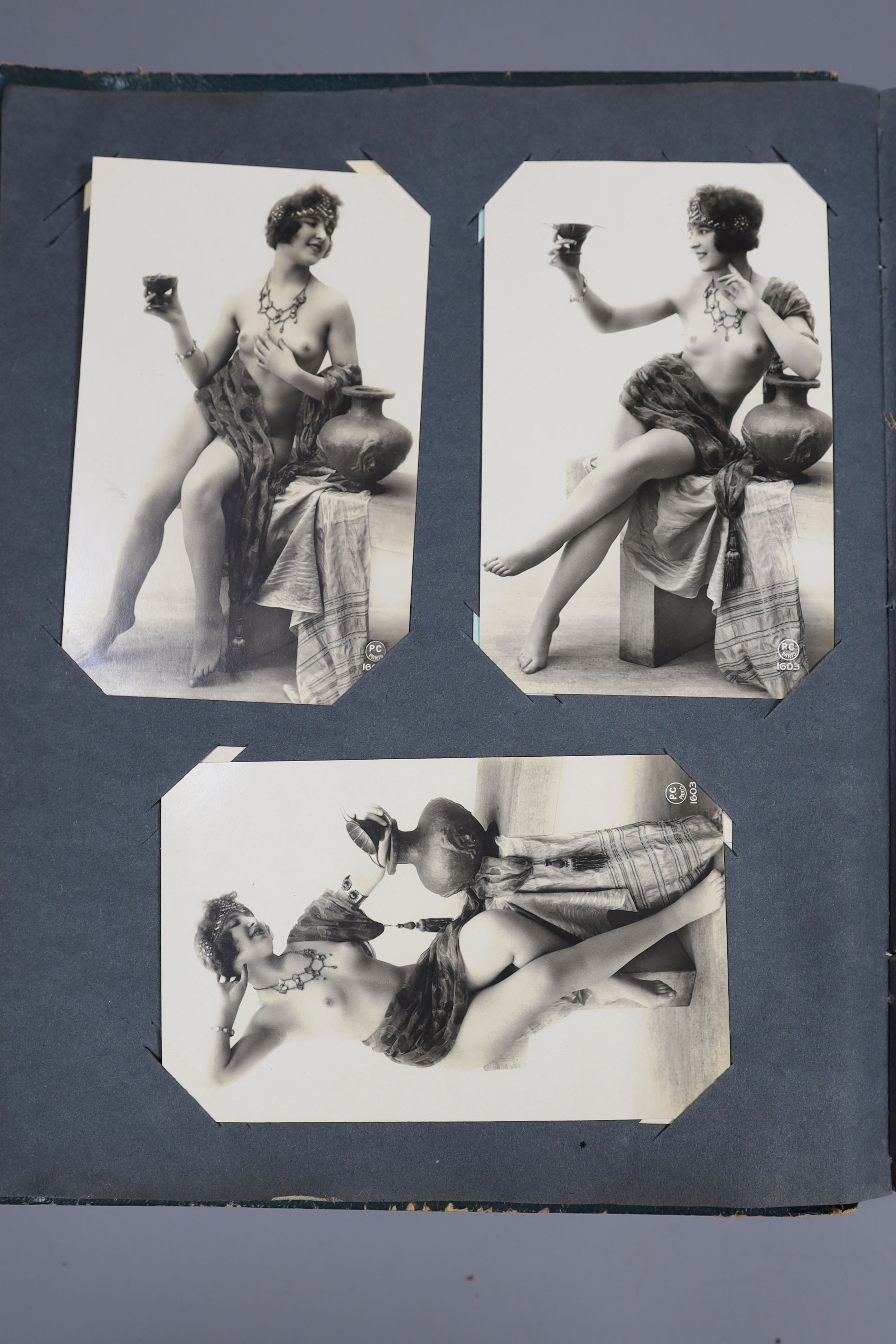 An Edwardian green postcard album, mounted with 68 risque cards and a brown album mounted with - Image 8 of 9