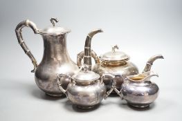 An early 20th century Chinese Export planished white metal four piece tea and coffee set, with