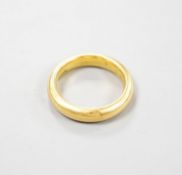 A 22ct gold wedding band, size K/L, 8.3 grams.