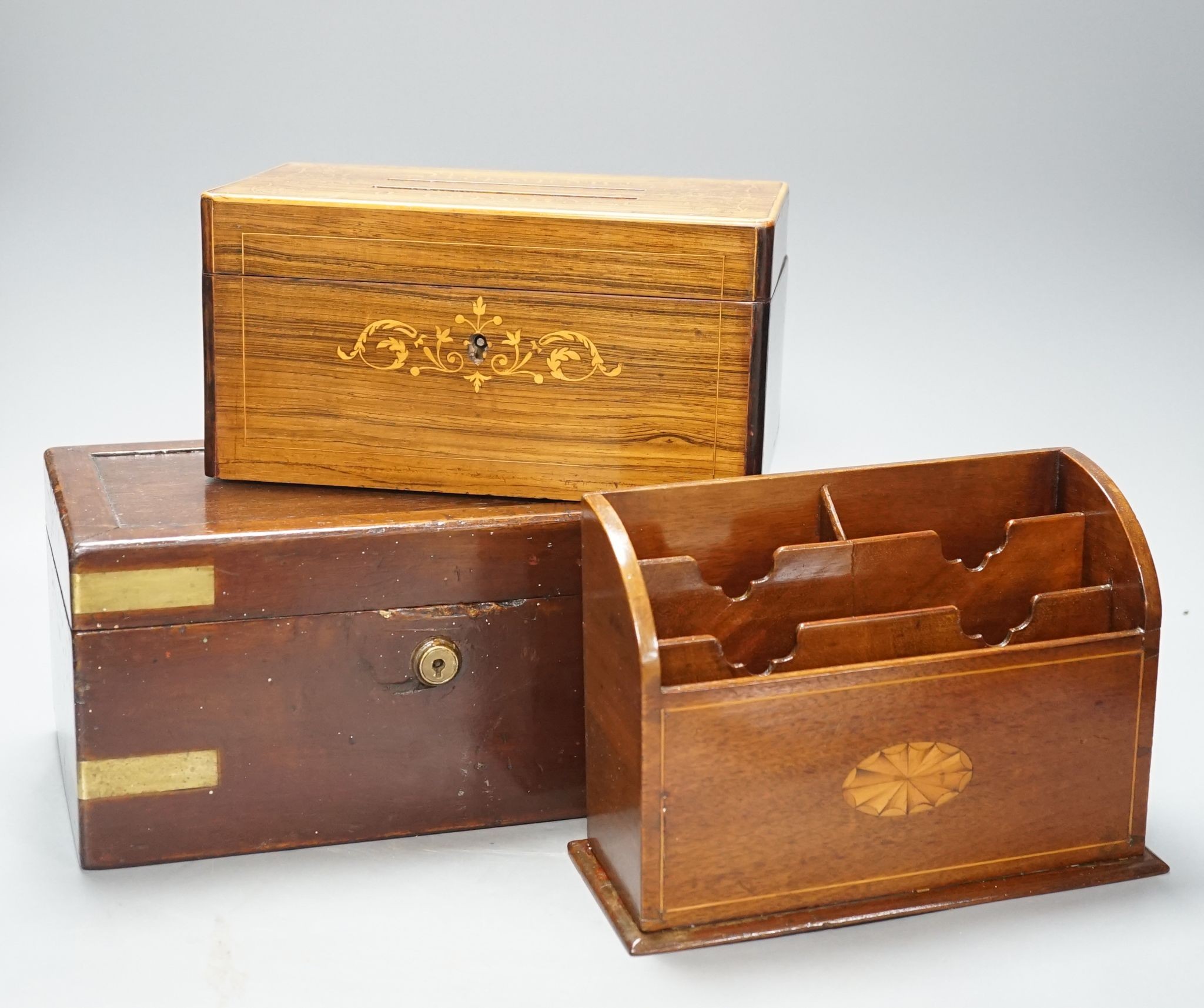 A 19th century French rosewood and marquetry letters box, an inlaid stationary rack and a brass-