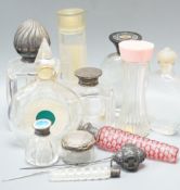 Various silver mounted glass toilet jars, scent bottles, etc,Largest item, 16 cms high.