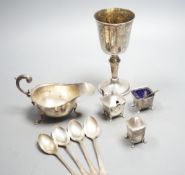 A modern silver goblet, 15.8cm, a silver sauceboat, four silver spoons and three silver