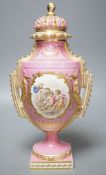 A Coalport two handled vase and cover painted with a Watteauesque scene to one side and a panel of