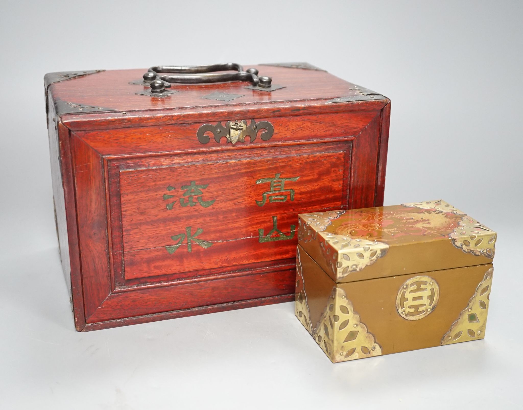 A MahJong set and a Chinese brass mounted card case.MahJong set, 15.5 cms high x 23.5 cms wide.