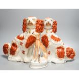 A pair of Victorian Staffordshire Spaniel chimney dogs and a greyhound, chimney dogs 31 cms high.