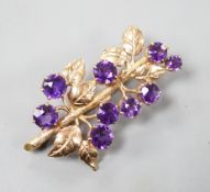 A modern 9ct gold and nine stone amethyst set spray brooch, 42mm, gross 7.6 grams, in fitted box.