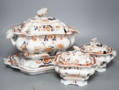 An early 19th century stoneware soup tureen and cover on stand, decorated in cobalt blue and iron