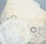 Two early 19th century, finely white worked lace hankies, various sets of lace mats and a lace