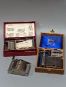 A group of cased vintage safety razors and shavers and four strops