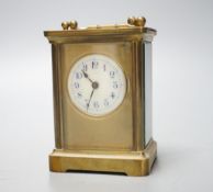 A cased brass carriage timepiece10.5 cms high high not including case.