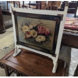 An Arts and Crafts painted copper mounted firescreen, width 64cm, height 78cm