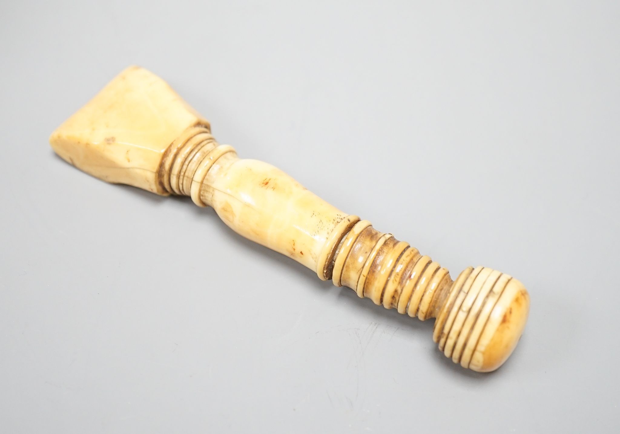 A Georgian marine ivory sail-maker's seam rubber,13 cms long.