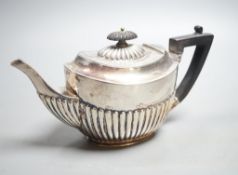 A late Victorian demi- fluted silver teapot, Sheffield, 1896, 8oz.