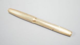 A 1940's Waterman's engine turned 9ct gold cased fountain pen, 12.9cm,gross weight 25.1 grams.