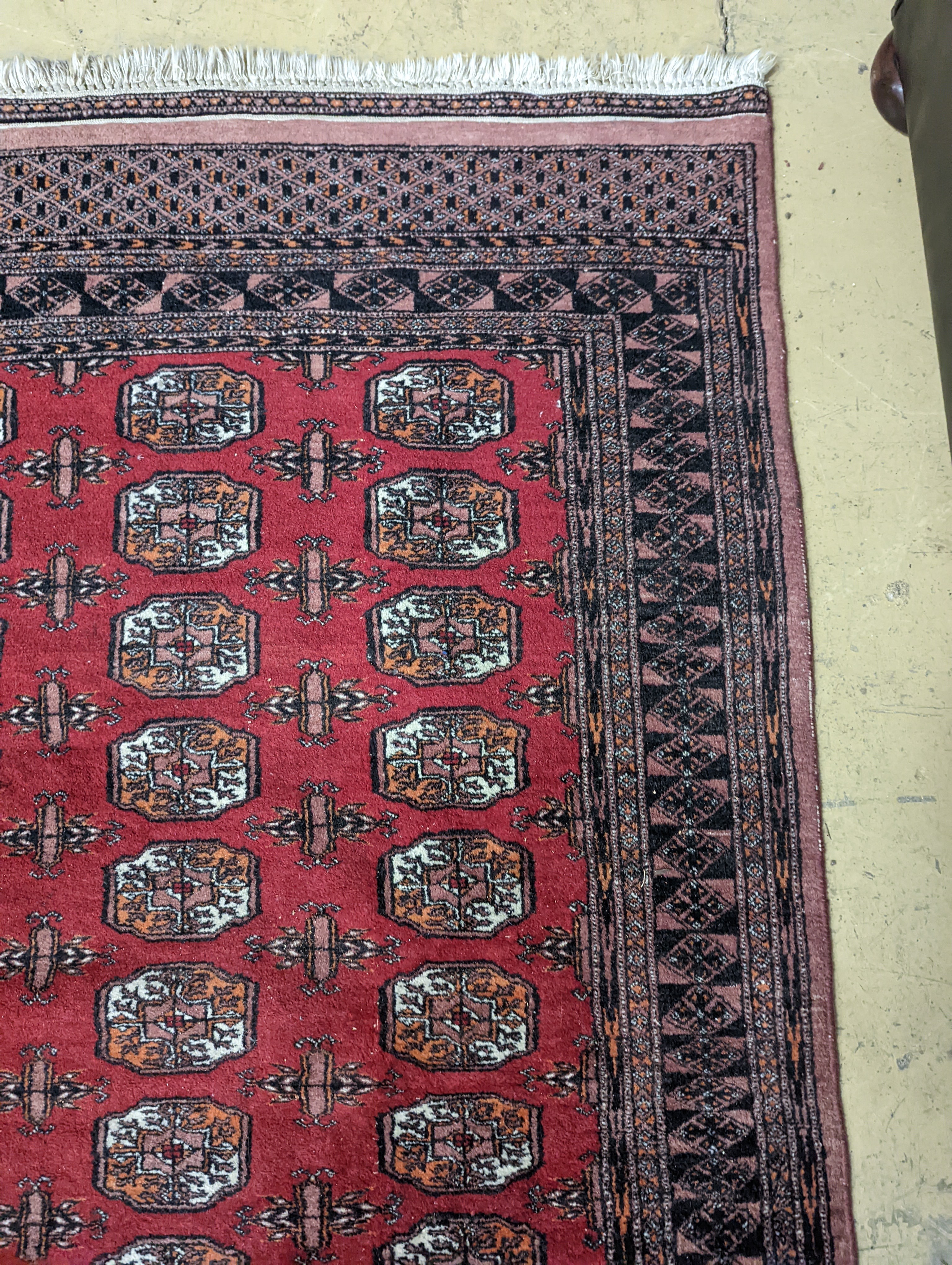 A Bokhara red ground rug, 196 x 126cm - Image 4 of 5