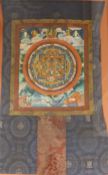 Tibetan School, painted thangka, Mandala with surrounding figures, 43 x 34cm, overall 92 x 60cm