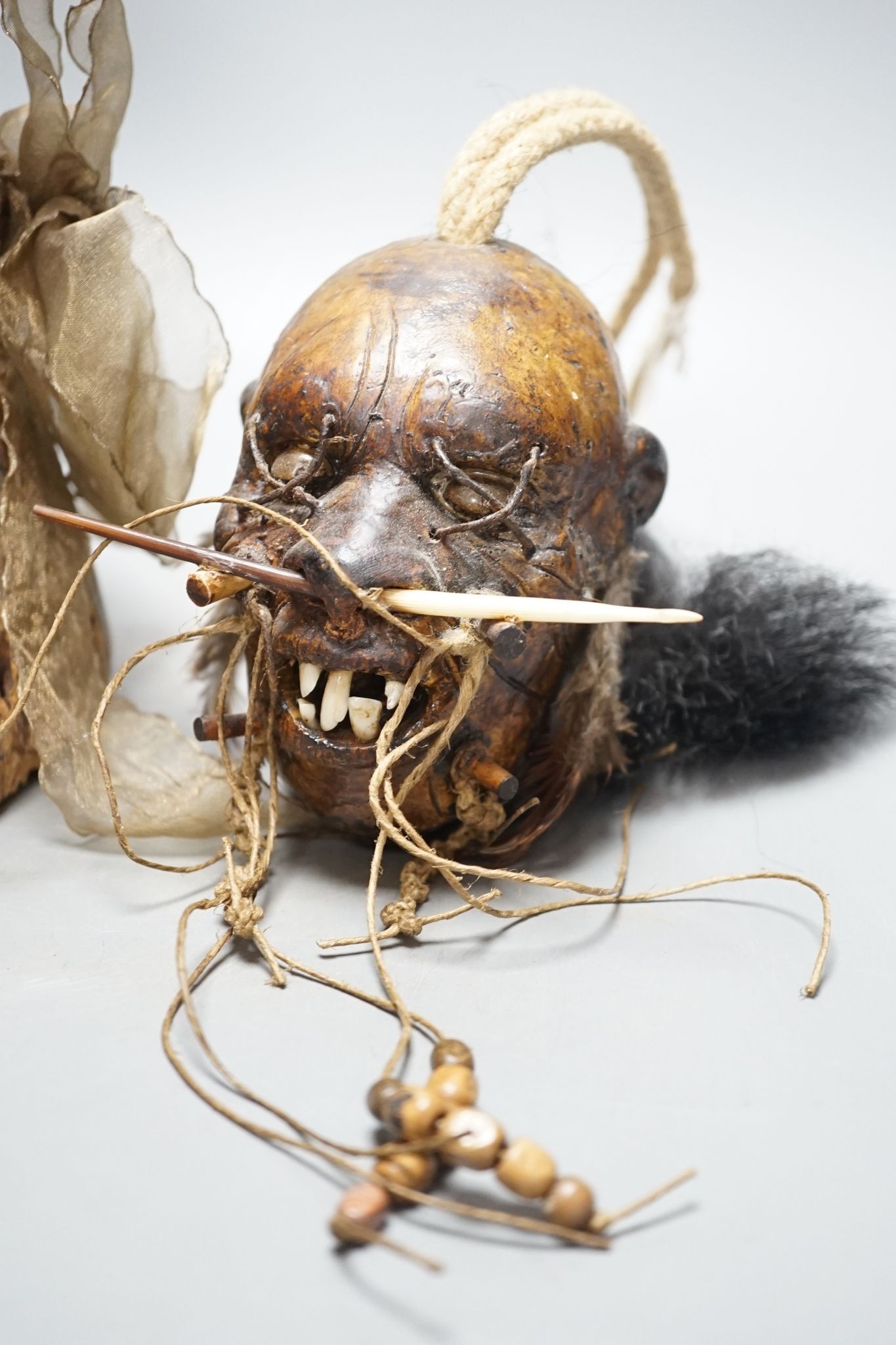 An African tribal carving, 31cm and a pottery model of a shrunken head - Image 4 of 6