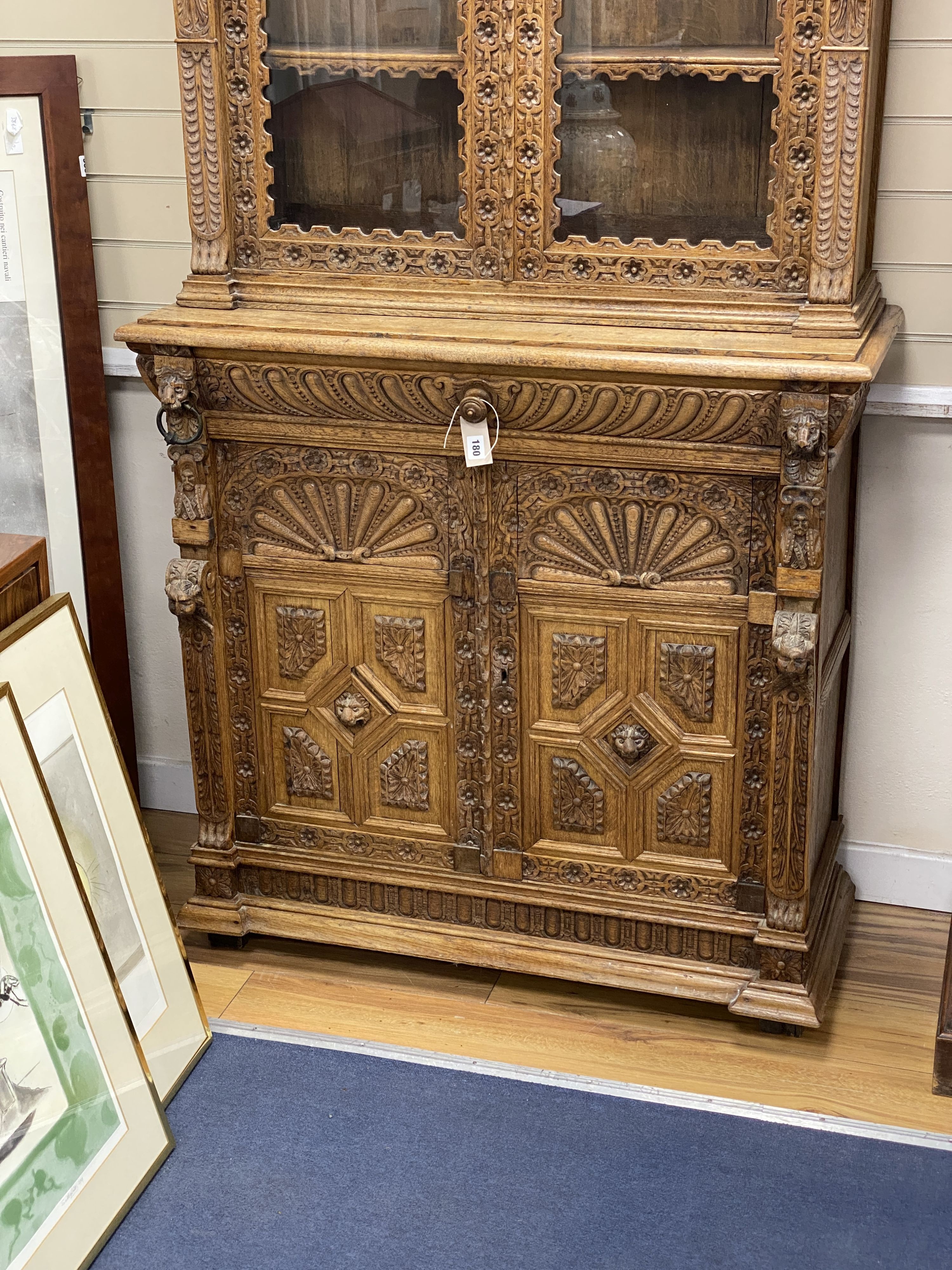 A late 19th century Flemish carved oak bookcase cupboard, width 102cm, depth 43cm, height 206cm - Image 2 of 3