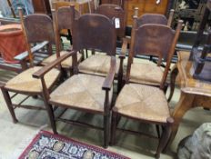 A set of six Arts & Crafts oak chairs, including a pair of carvers, in the Glasgow School manner