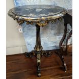 A Victorian mother of pearl inlaid gilt decorated circular tilt top papier mache tripod wine