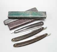 A Georgian leather cased cut throat razor and two similar 19th century razors