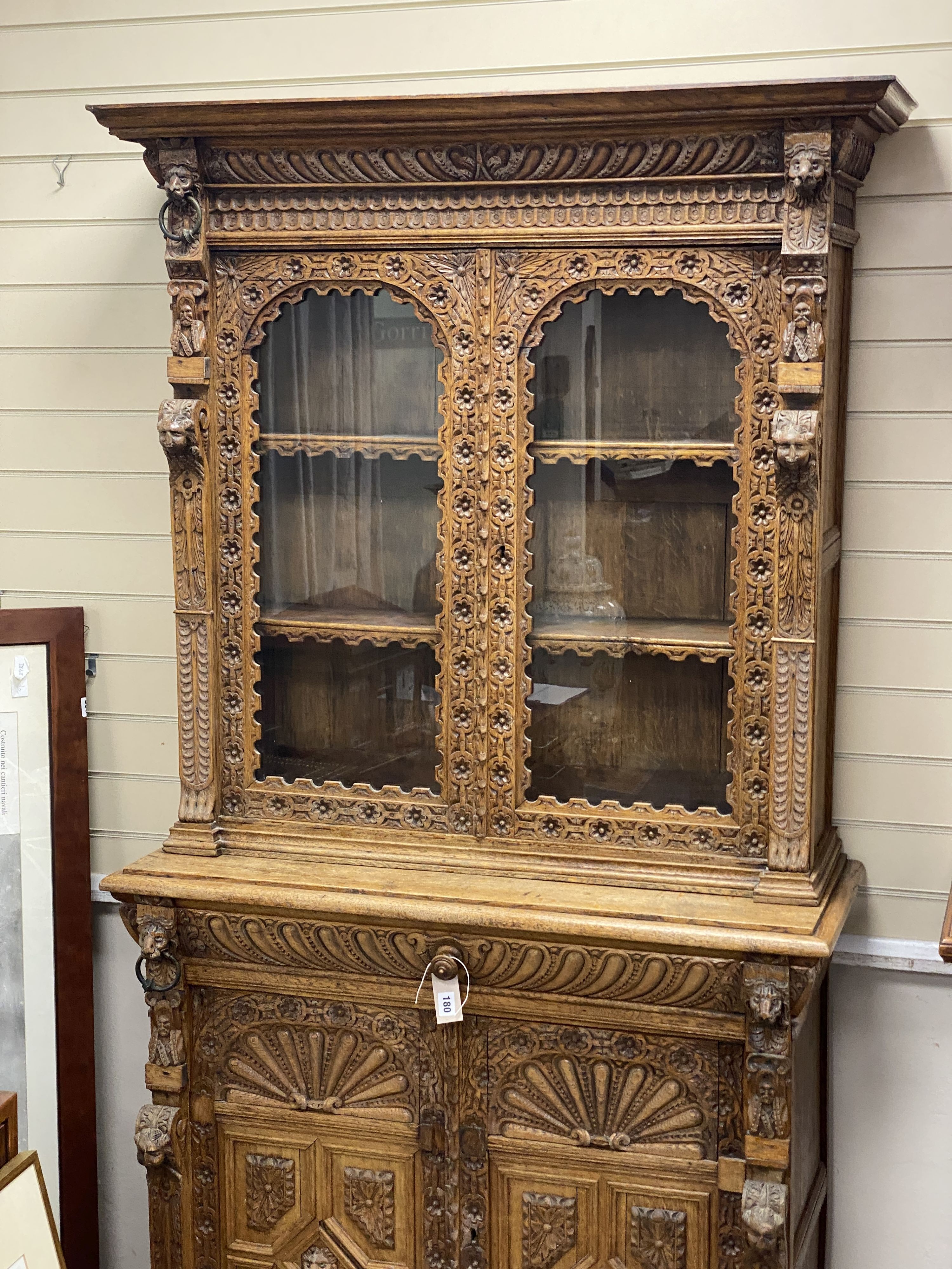 A late 19th century Flemish carved oak bookcase cupboard, width 102cm, depth 43cm, height 206cm - Image 3 of 3