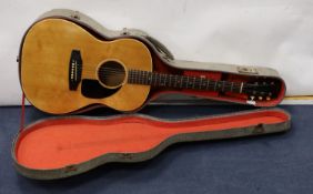 A Gibson acoustic guitar in hard case, serial no. 430 862