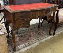 A reproduction George III style serpentine mahogany kneehole writing table, width 107cm, depth 55cm,