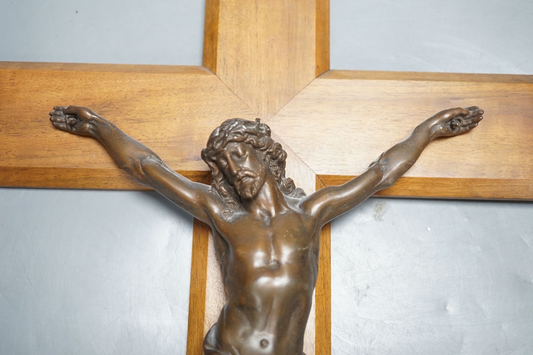 A bronze crucifix, mounted on a wooden cross,Height of cross, 60.5 cms. - Image 2 of 5