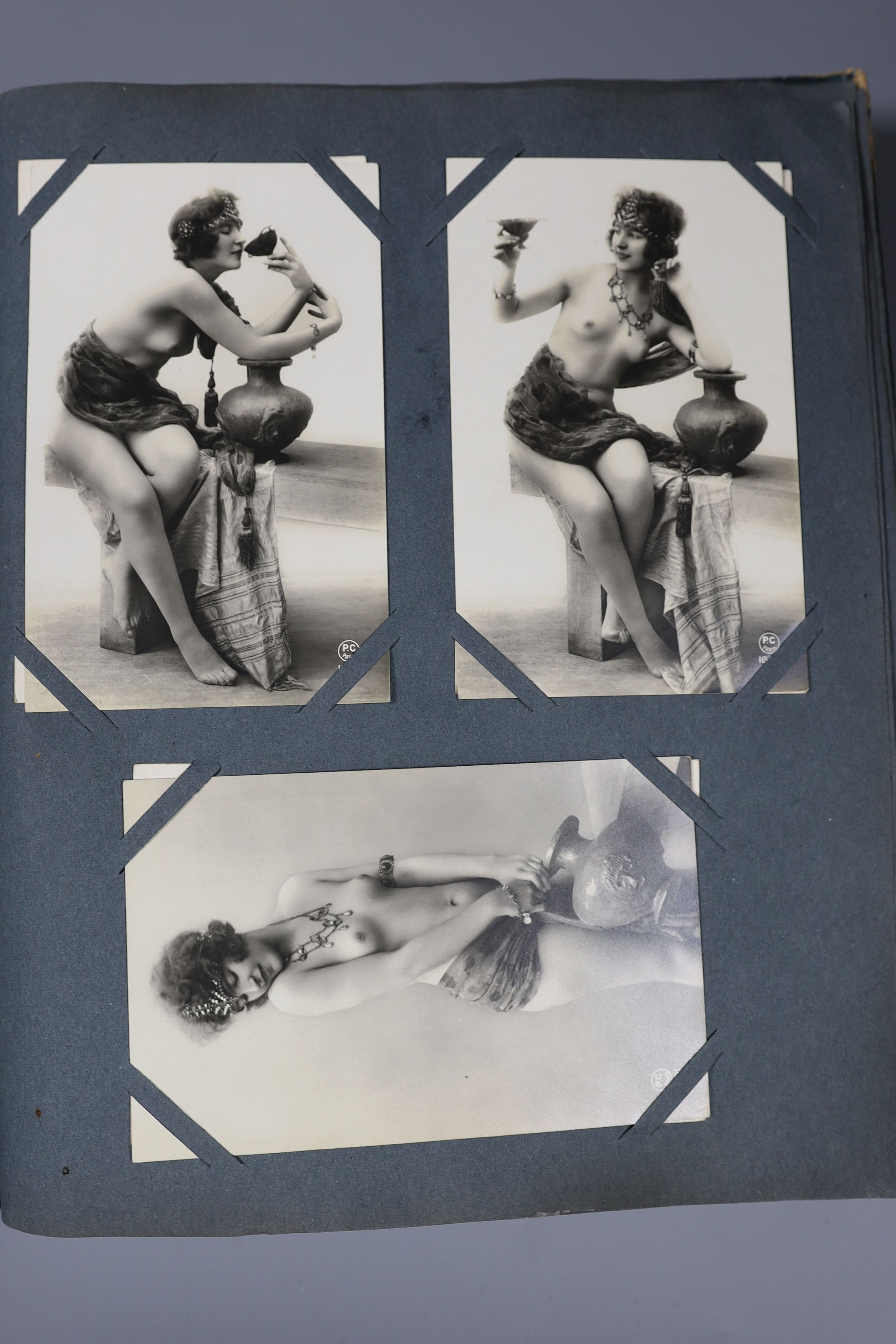 An Edwardian green postcard album, mounted with 68 risque cards and a brown album mounted with - Image 9 of 9