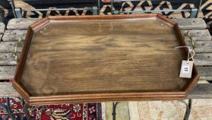 An Edwardian octagonal oak twin handled tray, length 62cm, depth 40cm