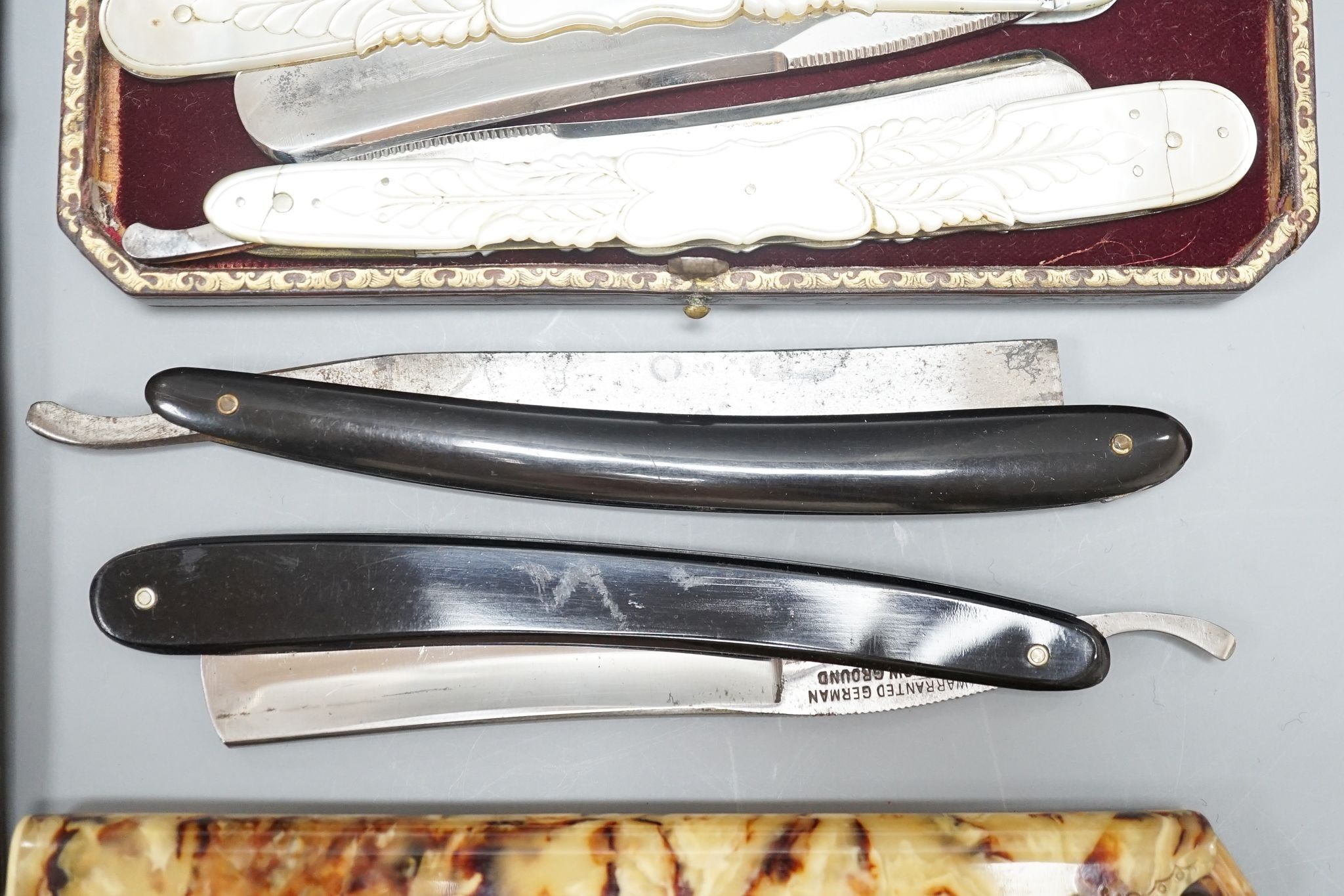 A leather cased pair of mother-of-pearl handled cut throat razors, by J Crawford and three other - Image 4 of 5