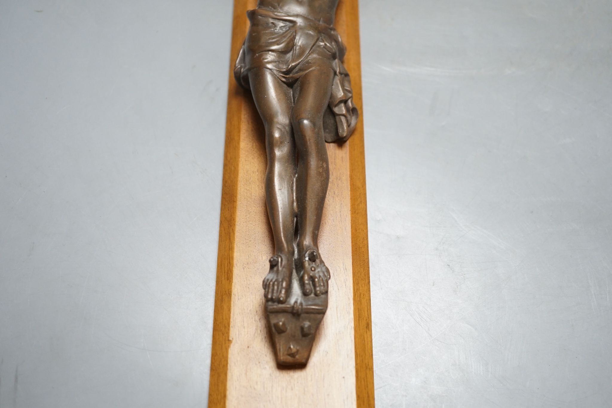 A bronze crucifix, mounted on a wooden cross,Height of cross, 60.5 cms. - Image 5 of 5
