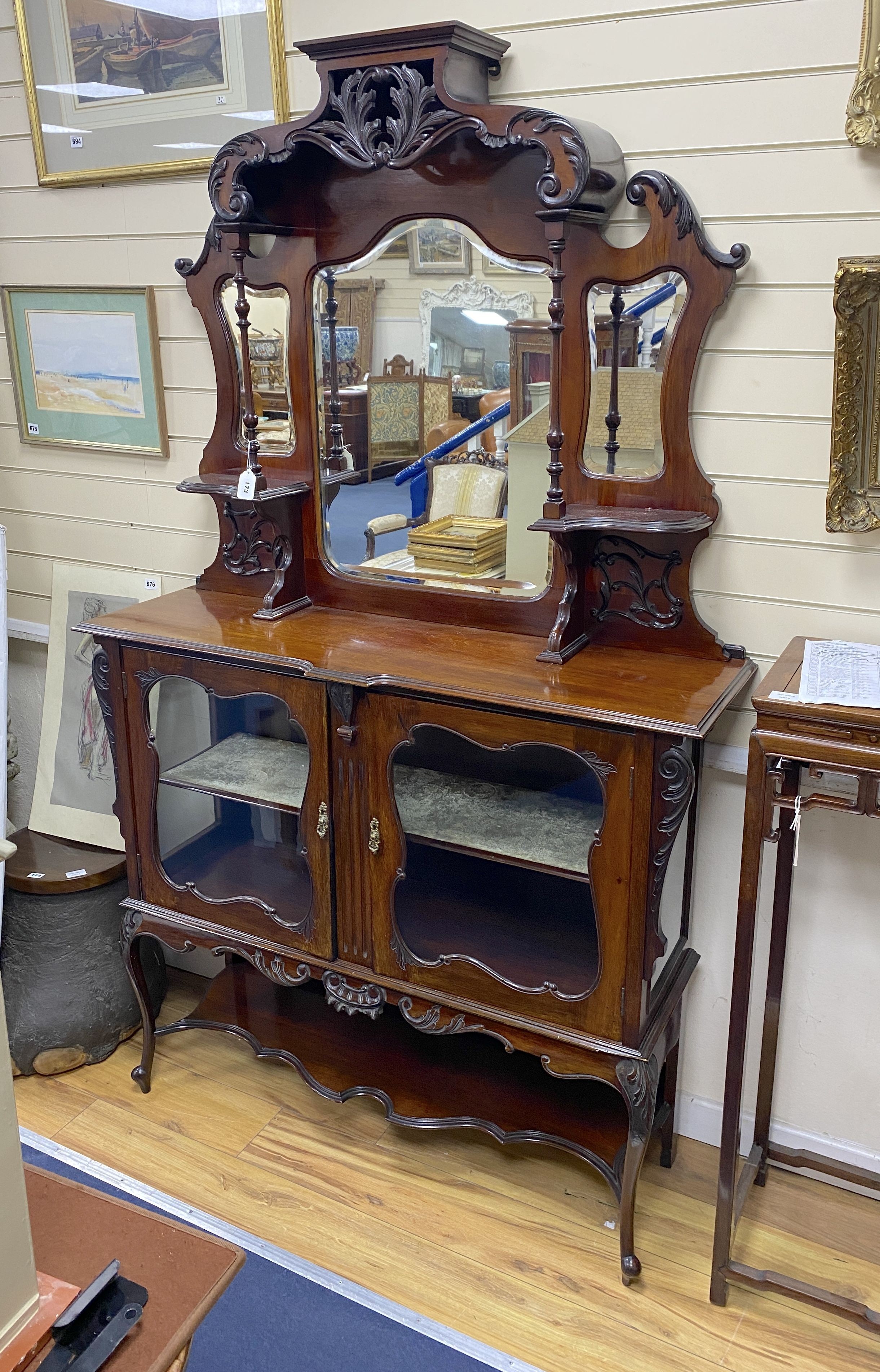 A late Victorian mahogany mirrored back side cabinet, width 122cm, depth 36cm, height 202cm