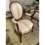 A 19th century French upholstered faded rosewood open armchair, width 62cm, depth 48cm, height 99cm