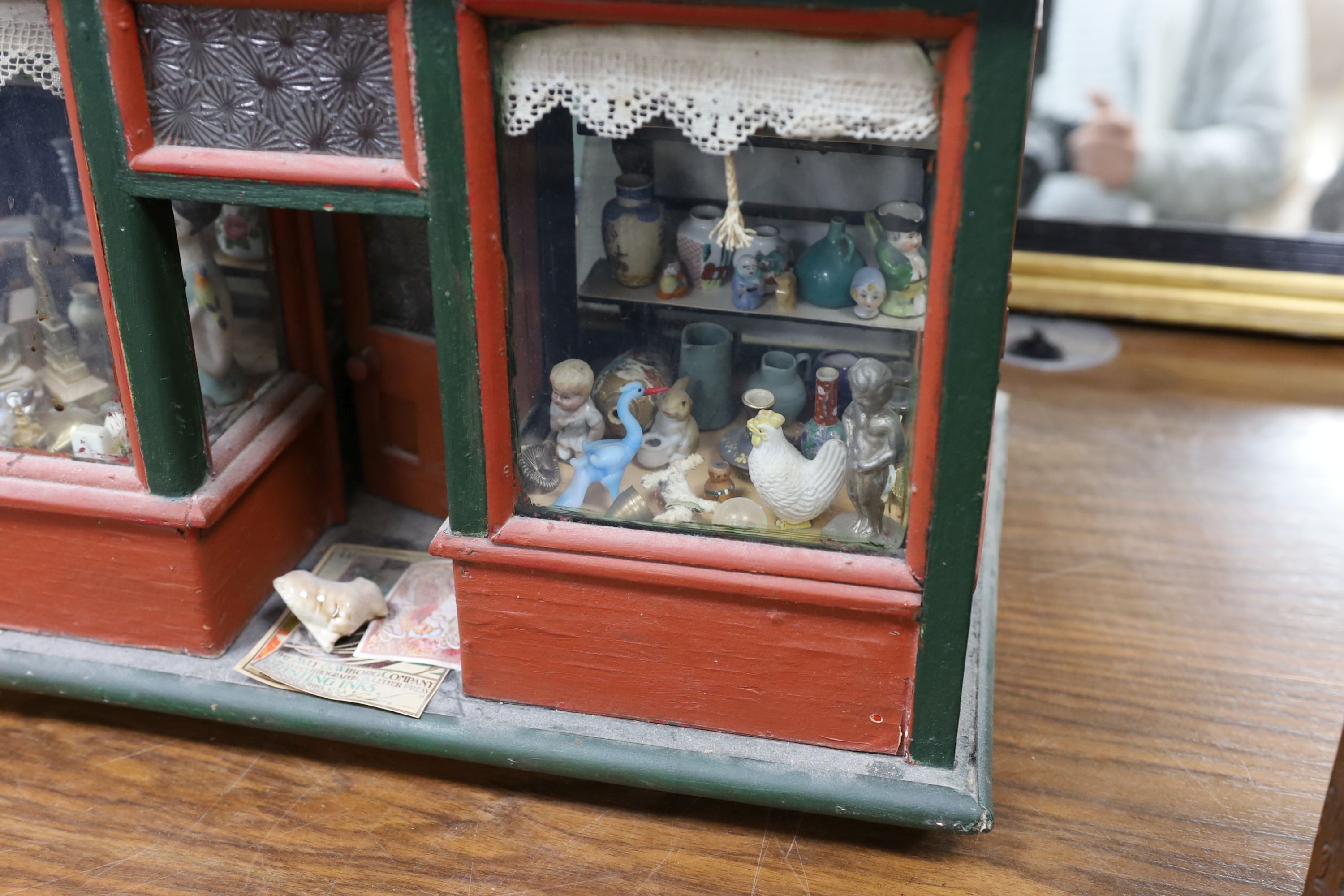 A dolls shop and contents43 cms high x 46 cms wide. - Image 3 of 4