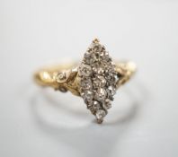 An 18ct and diamond cluster set marquise shaped ring, size K/L, gross 3.2 grams.