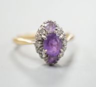 An early 20th century 18ct & plat, amethyst and diamond set marquise cluster ring, size K, gross