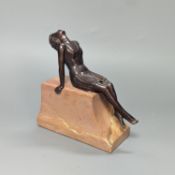 A French Art Deco style bronze of a reclining lady, on marble plinth 18cm