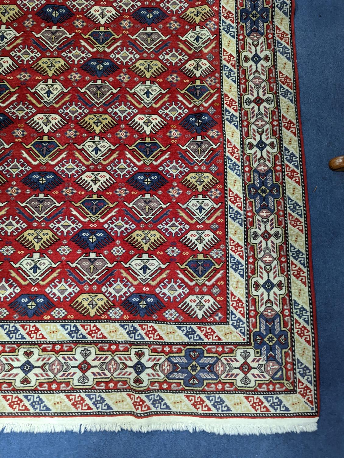 A Caucasian style red ground rug, 210 x 140cm - Image 3 of 5