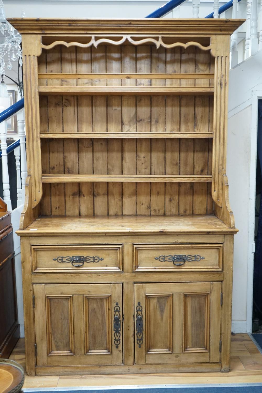 A 19th century style French provincial pine dresser, length 133cm, depth 50cm, height 220cm