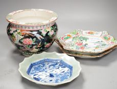 Three late 19th century Japanese porcelain dishes and a jardiniere, 19 cms high.