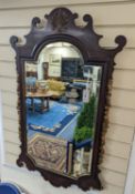 An early 20th century George III style parcel gilt fret cut mahogany wall mirror, width 59cm, height