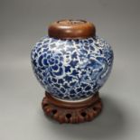 A Chinese blue and white ‘dragon’ jar, hardwood cover & stand, Qianlong mark but 19th century 22cm