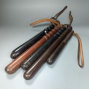 A collection of five 19th century and later wooden truncheons,largest 39 cms long.